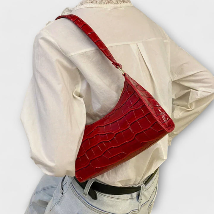 Laura. - Skinnende lædertaske