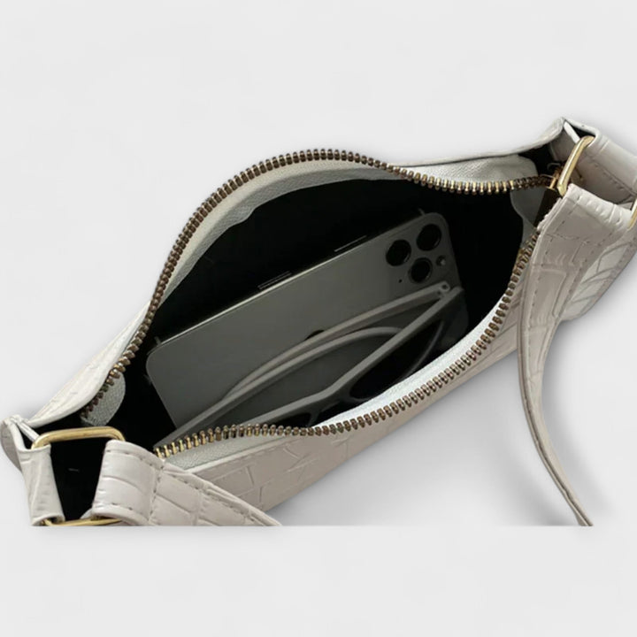 Laura. - Skinnende lædertaske