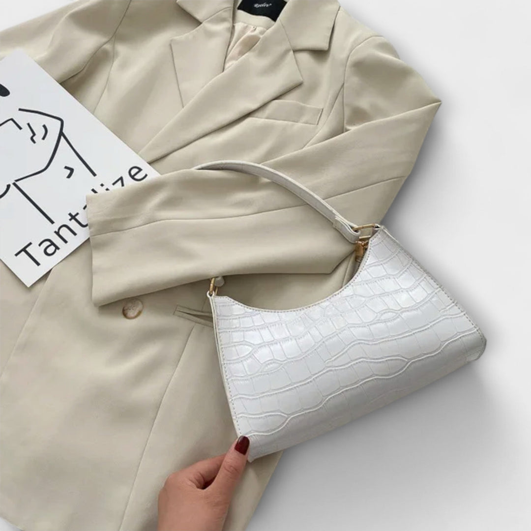 Laura. - Skinnende lædertaske